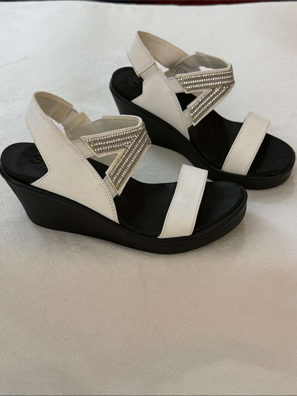 White Sketchers Luxe Foam Rumble Wedge Sandals with Rhinestone Accent